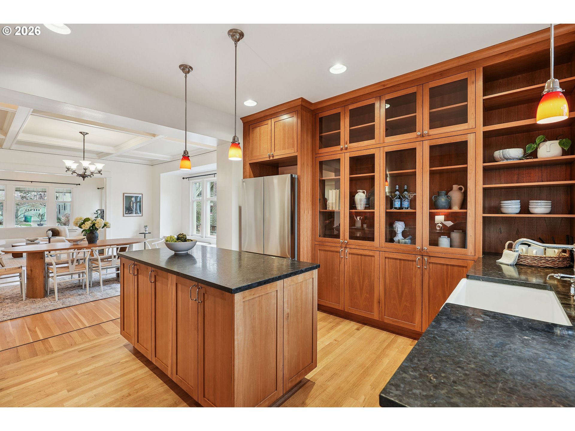 2715 Northeast 38th Avenue Portland, OR 97212 - Photo 25 of 45 a kitchen with stainless steel appliances kitchen island granite countertop a sink and wooden cabinets