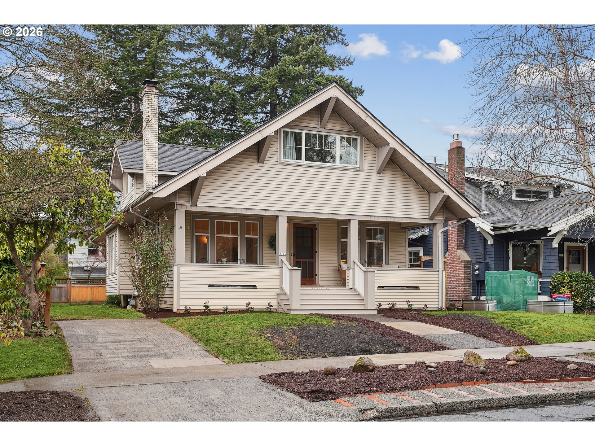 2715 Northeast 38th Avenue Portland, OR 97212 - Photo 3 of 45 a front view of a house with a yard and garage