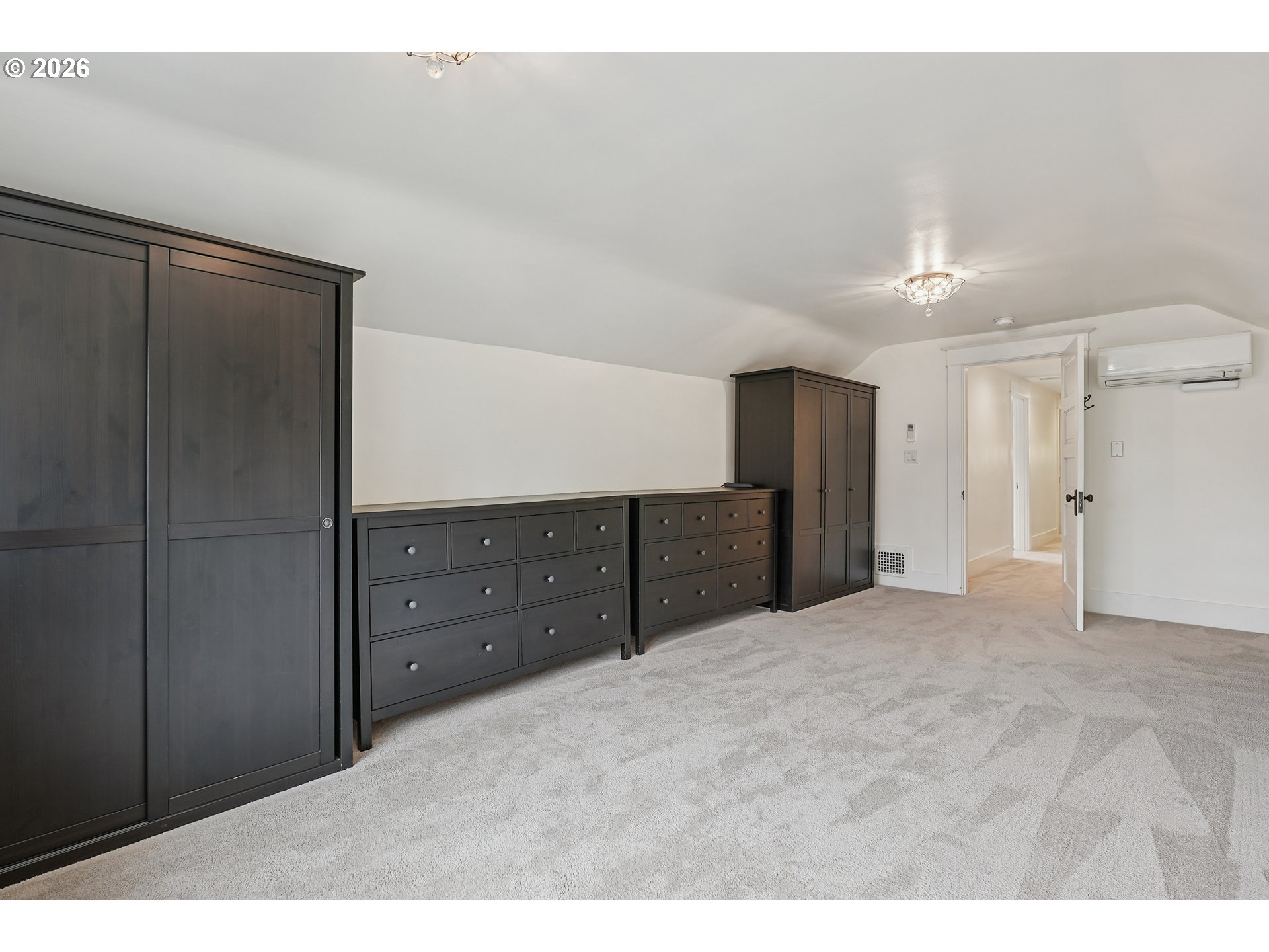 2715 Northeast 38th Avenue Portland, OR 97212 - Photo 37 of 45 a large bedroom with a dresser and mirror