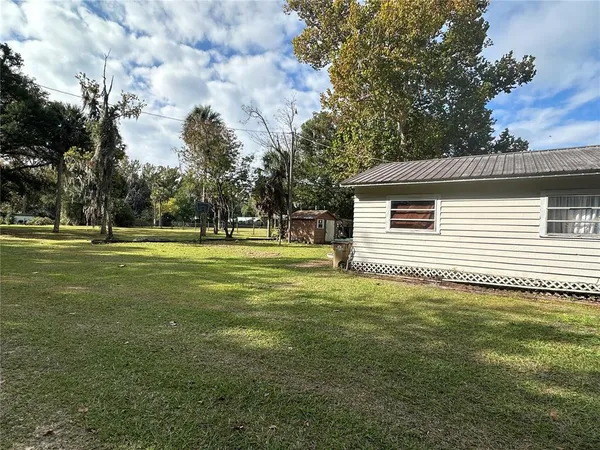 a backyard of a house with lots of green space