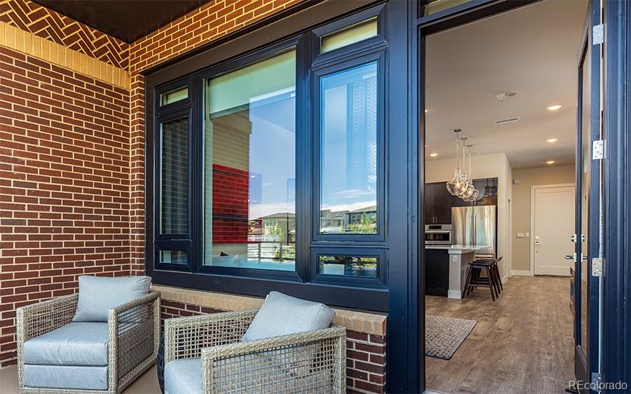 6618 East Lowry Boulevard, Unit 307 Denver, CO 80230 - Photo 12 of 23 a view of kitchen with furniture and large window