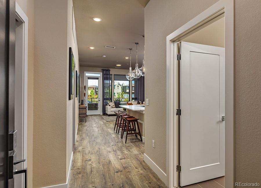 6618 East Lowry Boulevard, Unit 307 Denver, CO 80230 - Photo 14 of 23 a view of a dining room with furniture window and wooden floor