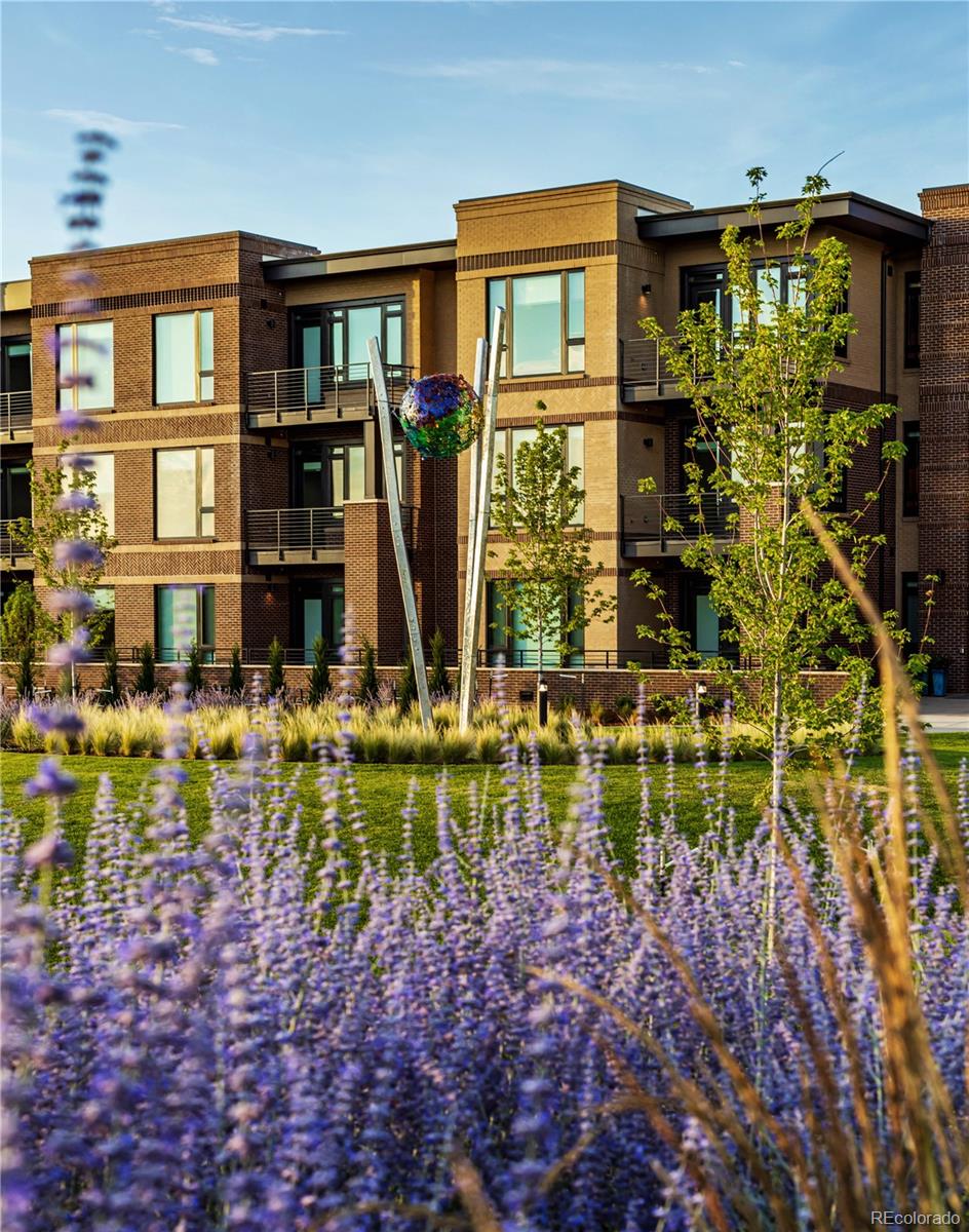6618 East Lowry Boulevard, Unit 307 Denver, CO 80230 - Photo 18 of 23 a front view of a house with a yard