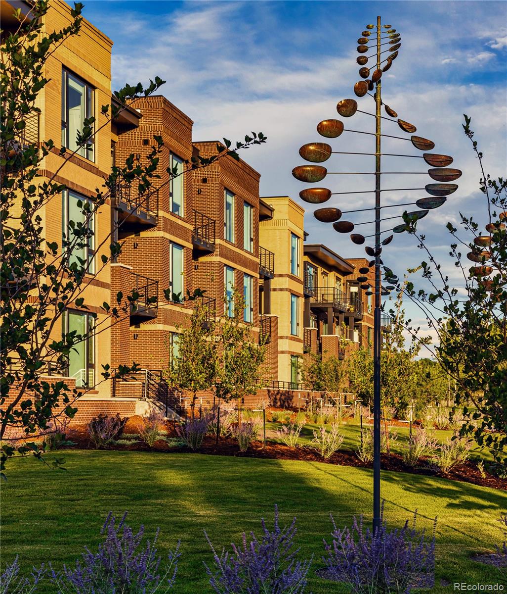 6618 East Lowry Boulevard, Unit 307 Denver, CO 80230 - Photo 19 of 23 a front view of a building with garden