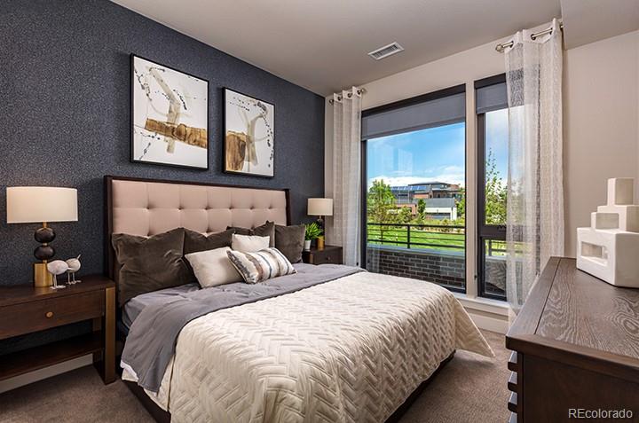 6618 East Lowry Boulevard, Unit 307 Denver, CO 80230 - Photo 7 of 23 a bedroom with a large bed and a window
