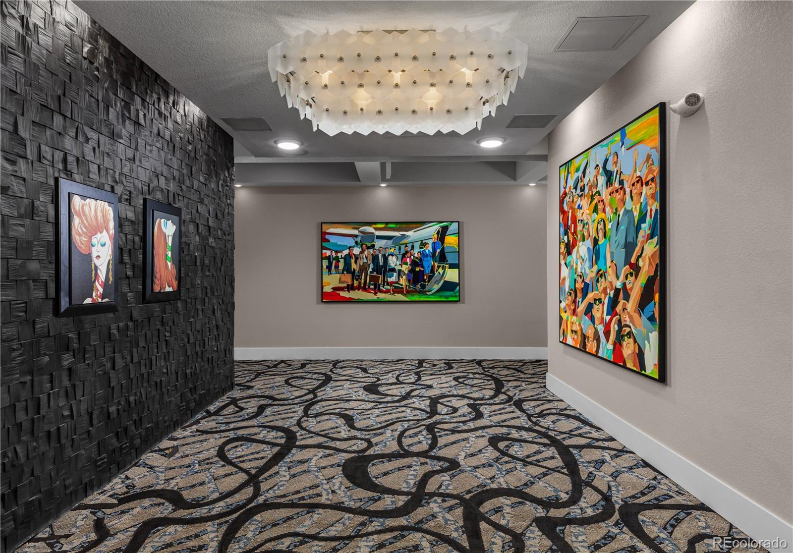 6618 East Lowry Boulevard, Unit 307 Denver, CO 80230 - Photo 9 of 23 en bathroom with painting on the wall and a large mirror