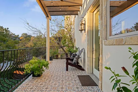 a view of a balcony with chairs