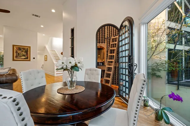a view of a dining room with furniture and window
