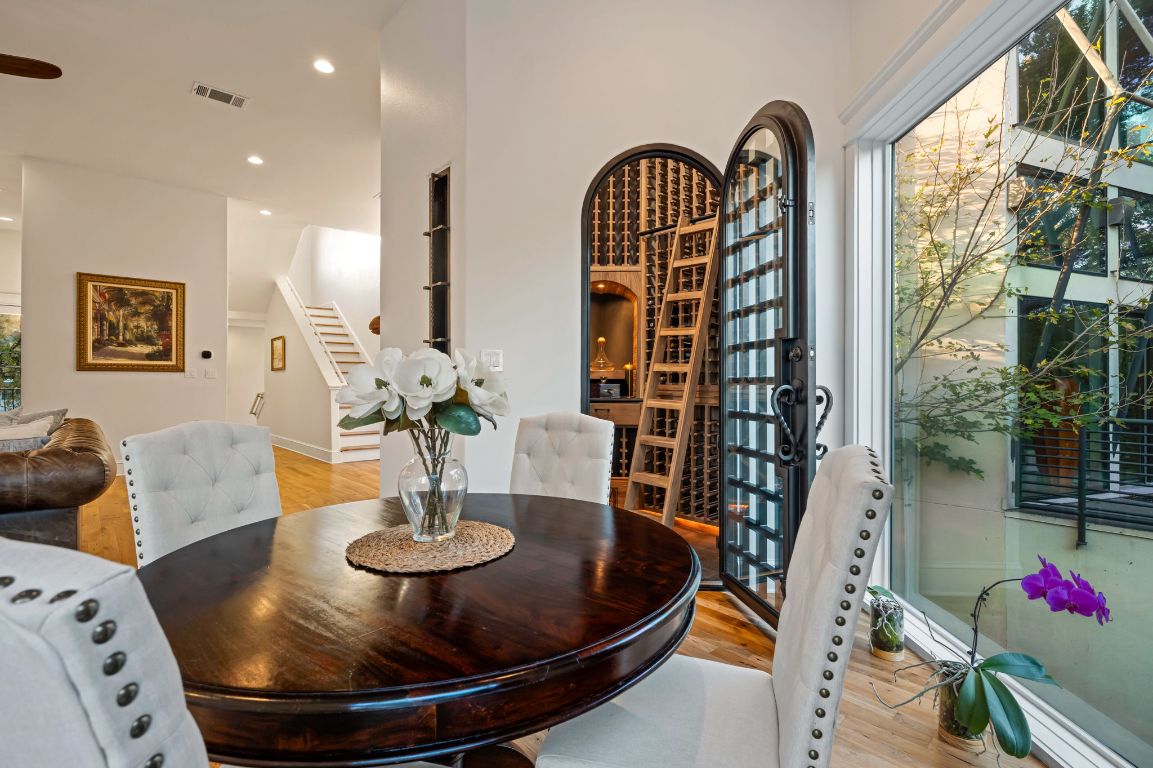 1231 Parkway, Unit 2 Austin, TX 78703 - Photo 15 of 40 Incredible custom wine cellar off dining room with picture window showcasing greenery