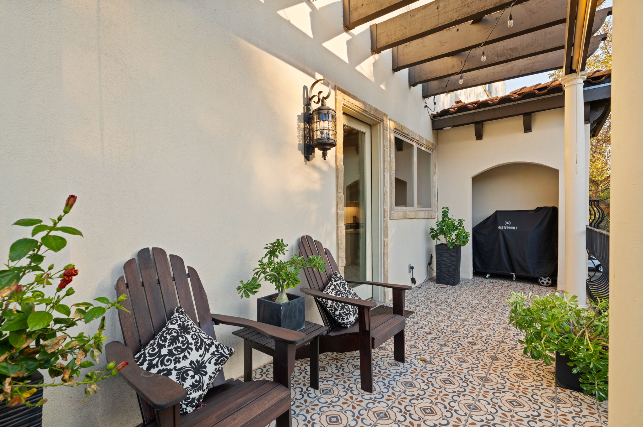 1231 Parkway, Unit 2 Austin, TX 78703 - Photo 16 of 40 a outdoor living room with furniture and a potted plant