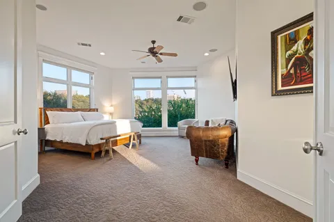 a bedroom with a bed and a couch