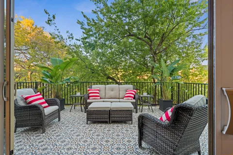 a outdoor living space with furniture and a potted plant
