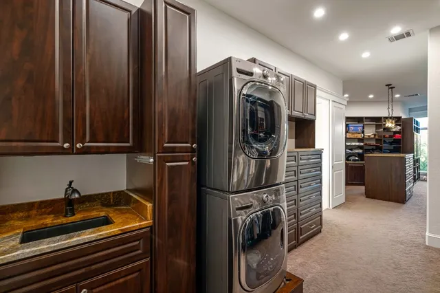 a kitchen with stainless steel appliances granite countertop a stove and a sink