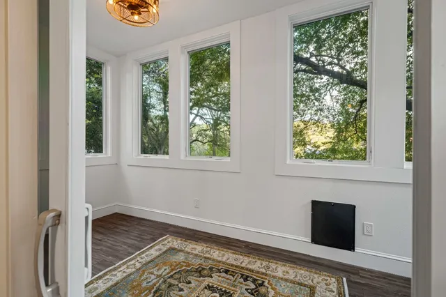 a view of a house with backyard and sitting area