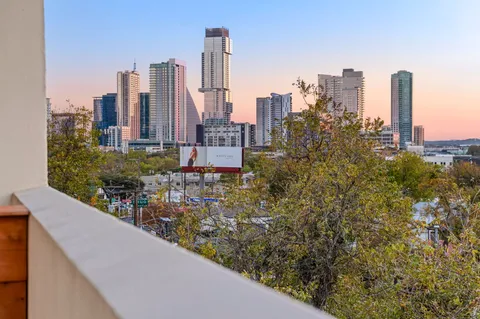 a view of a city with tall buildings