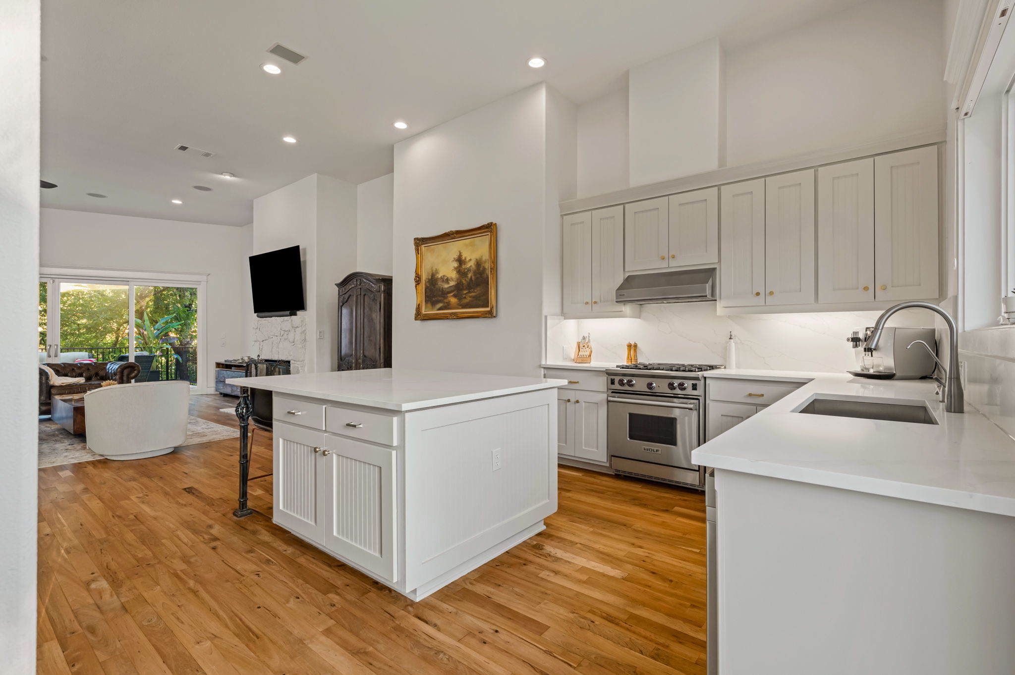 1231 Parkway, Unit 2 Austin, TX 78703 - Photo 9 of 40 a kitchen with stainless steel appliances white cabinets a sink and a stove