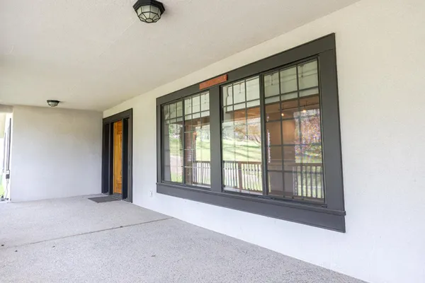 a kitchen with stainless steel appliances kitchen island granite countertop a refrigerator and a stove