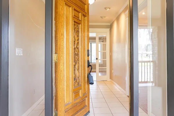a large kitchen with kitchen island granite countertop a sink counter top space and stainless steel appliances