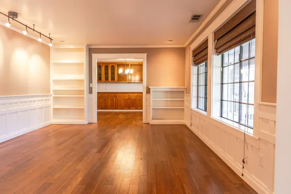 a view of walk in closet with empty racks
