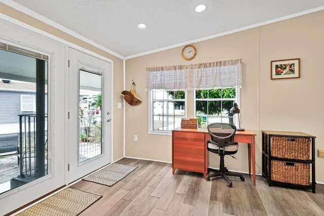 a work room with furniture and windows