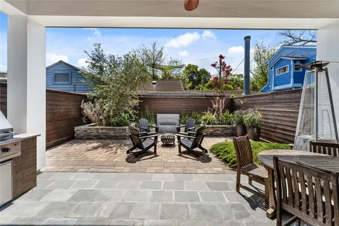 a terrace with seating area and appliances