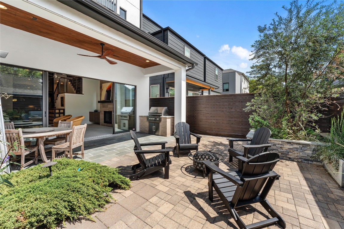 917 Peden Street Houston, TX 77006 - Photo 18 of 50 Enjoy multiple outdoor living zones, from dining to lounging, all within a beautifully curated backyard setting. High-end finishes and thoughtful landscaping create a tranquil, resort-like atmosphere. This outdoor space perfectly complements the home’s luxury lifestyle.