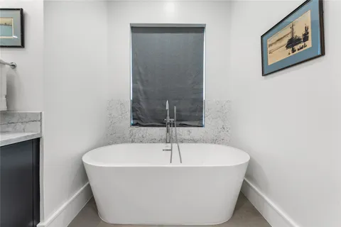 a bathroom with a shower and a sink