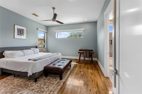 a bed room with a bed and a window