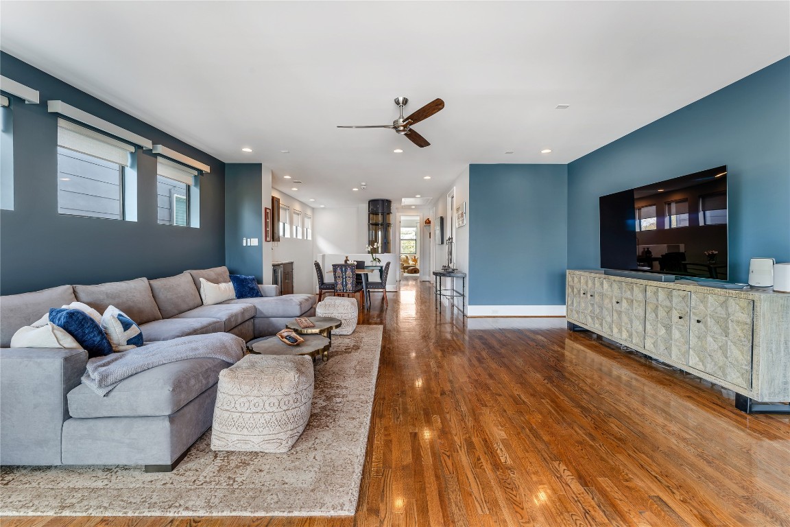 917 Peden Street Houston, TX 77006 - Photo 39 of 50 A sleek media wall provides the perfect focal point for relaxing or entertaining. The generous layout offers flexibility for multiple seating arrangements. High ceilings and recessed lighting enhance the room’s open, modern feel.