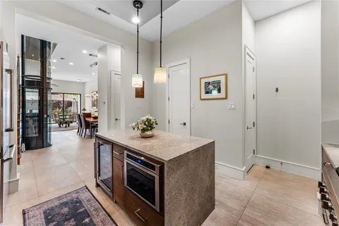 a stove top oven sitting inside of a kitchen