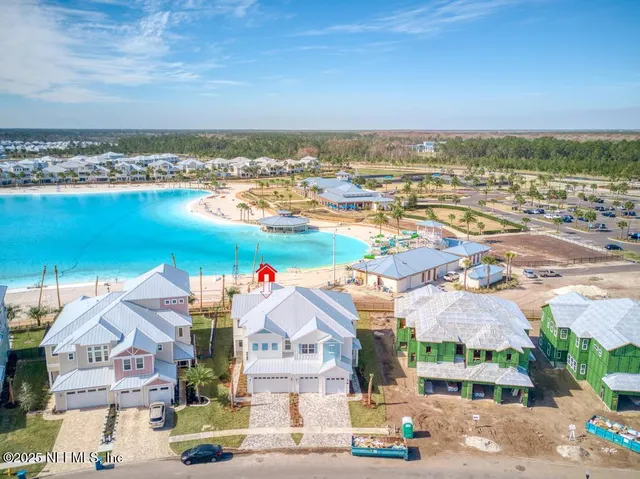 an aerial view of residential houses with outdoor space