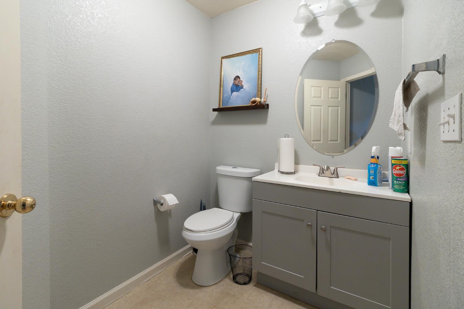 6282 Crestview Circle Stockton, CA 95219 - Photo 14 of 22 a bathroom with a toilet sink and mirror