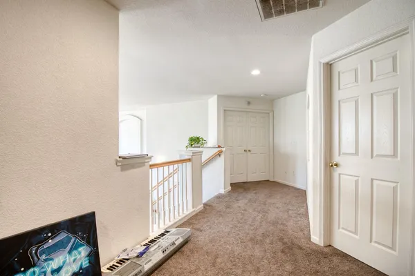 a view of entryway with kitchen