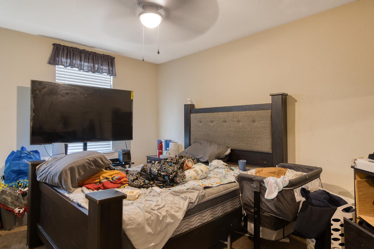 6282 Crestview Circle Stockton, CA 95219 - Photo 20 of 22 a bedroom with a bed and a flat screen tv
