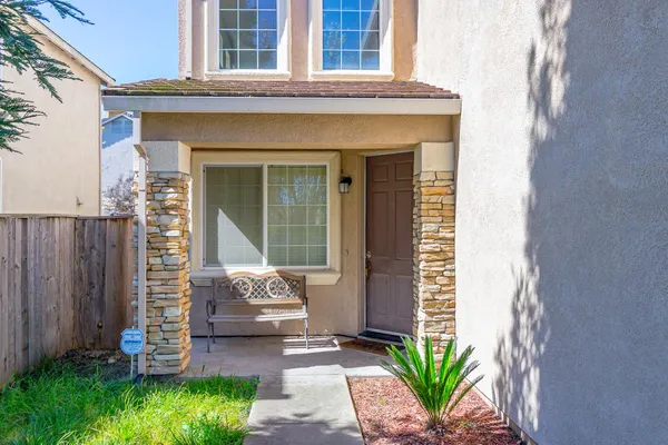 a front view of a house with a yard