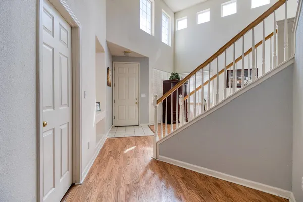 a view of an entryway with wooden floor