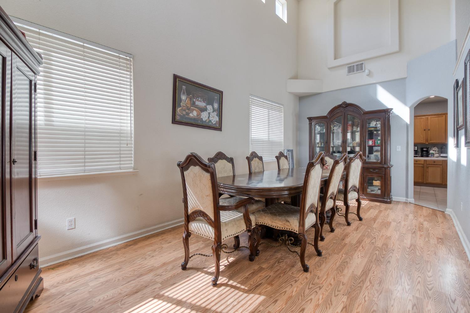 6282 Crestview Circle Stockton, CA 95219 - Photo 7 of 22 a view of a dining room with furniture and wooden floor