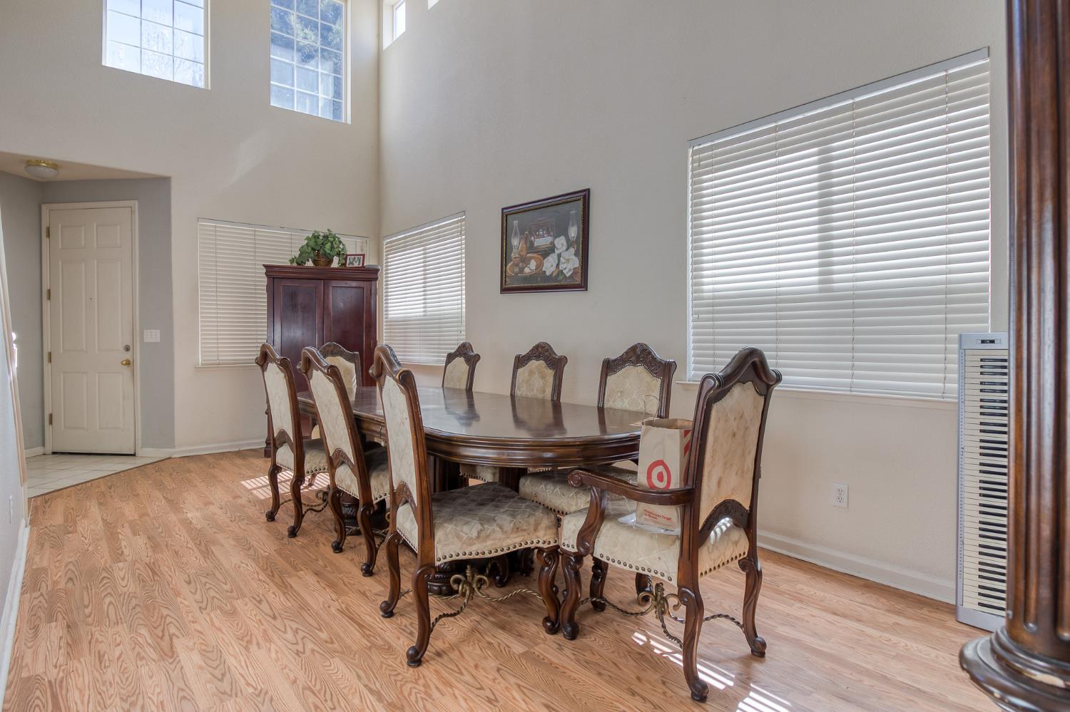 6282 Crestview Circle Stockton, CA 95219 - Photo 8 of 22 a view of a dining room with furniture and wooden floor
