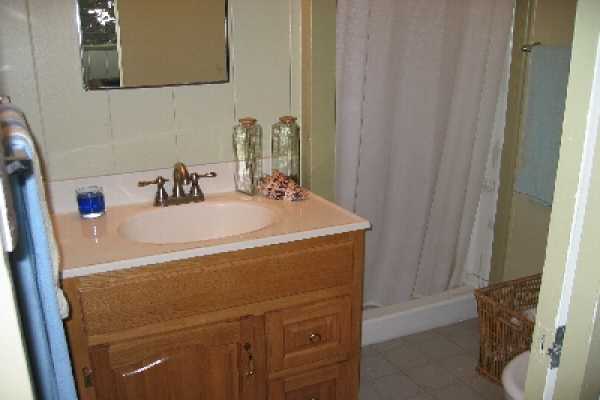 82-1052 Kinue Road Captain Cook, HI 96704 - Photo 8 of 9 a bathroom with a sink and a mirror