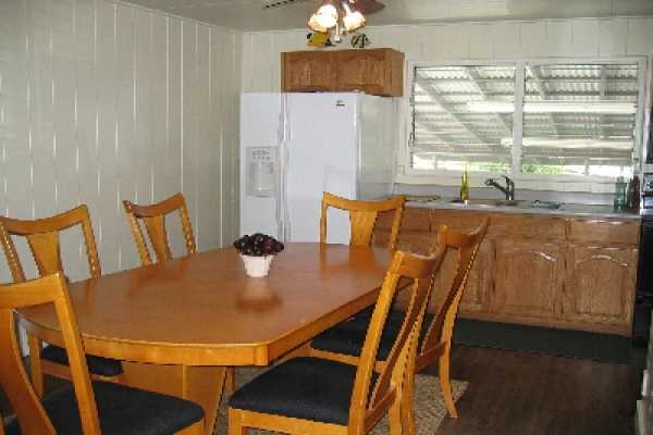 82-1052 Kinue Road Captain Cook, HI 96704 - Photo 9 of 9 a view of a dining room with furniture and window