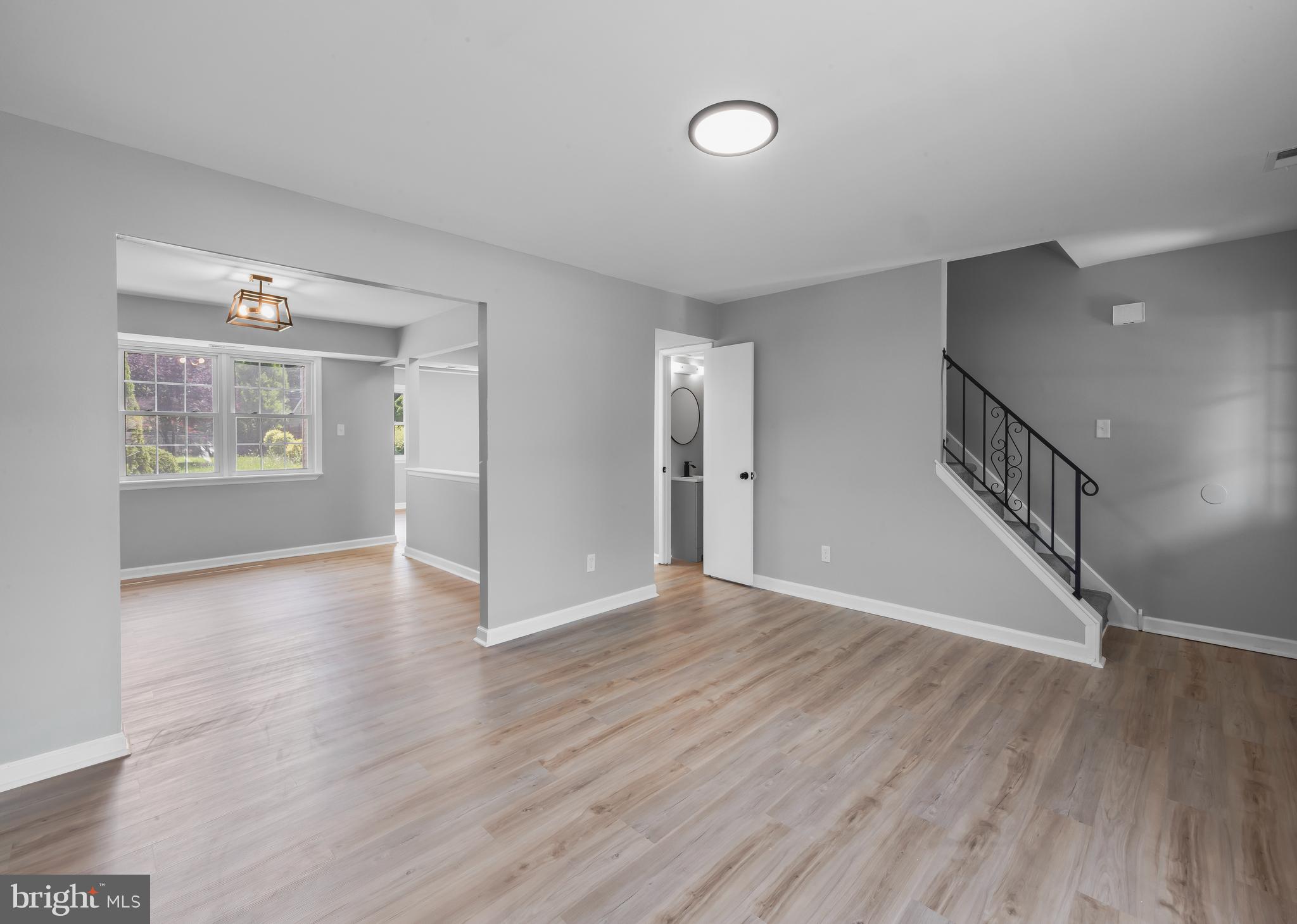 6 Heron Place Clementon, NJ 08021 - Photo 13 of 29 a view of an empty room with wooden floor and a window