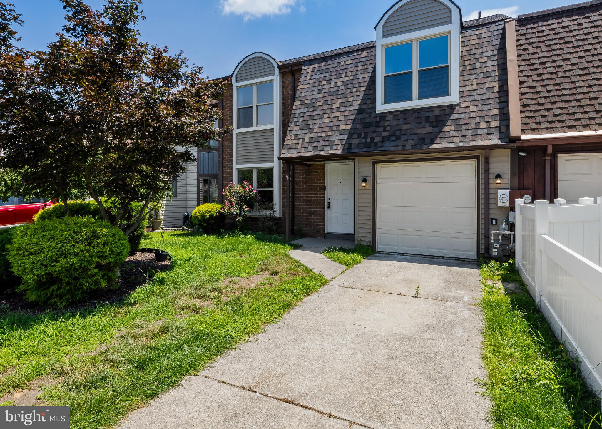 6 Heron Place Clementon, NJ 08021 - Photo 2 of 29 a front view of a house with a yard and garage