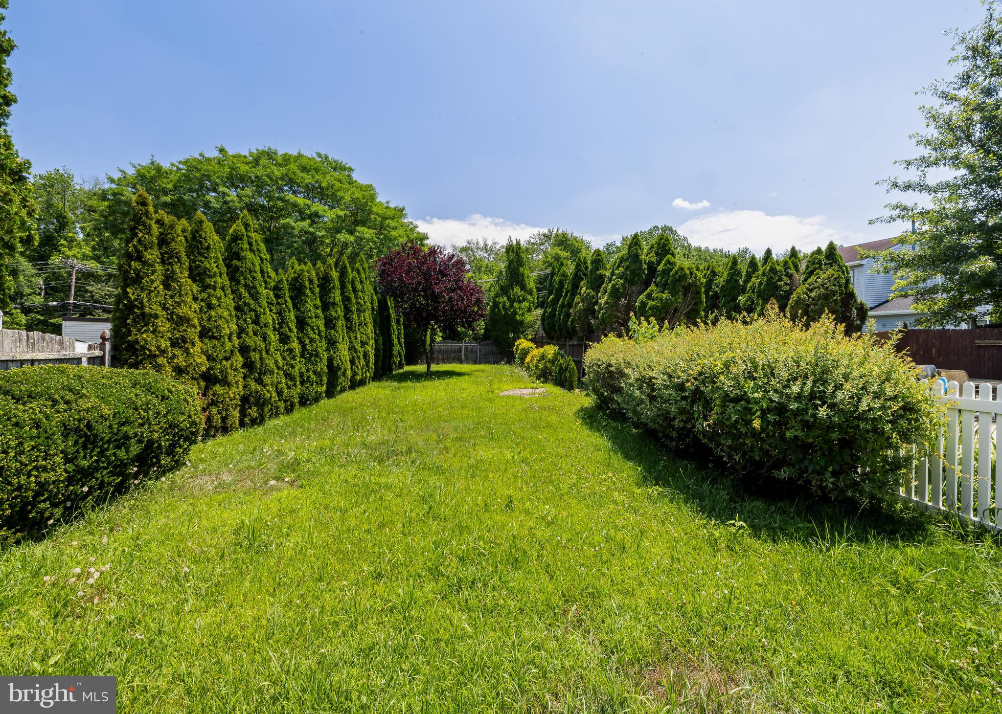 6 Heron Place Clementon, NJ 08021 - Photo 4 of 29 a view of a garden with a building in the background