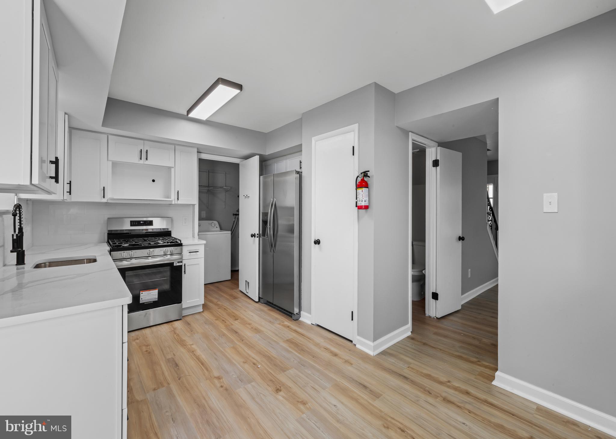 6 Heron Place Clementon, NJ 08021 - Photo 5 of 29 a kitchen with granite countertop a refrigerator and a stove top oven