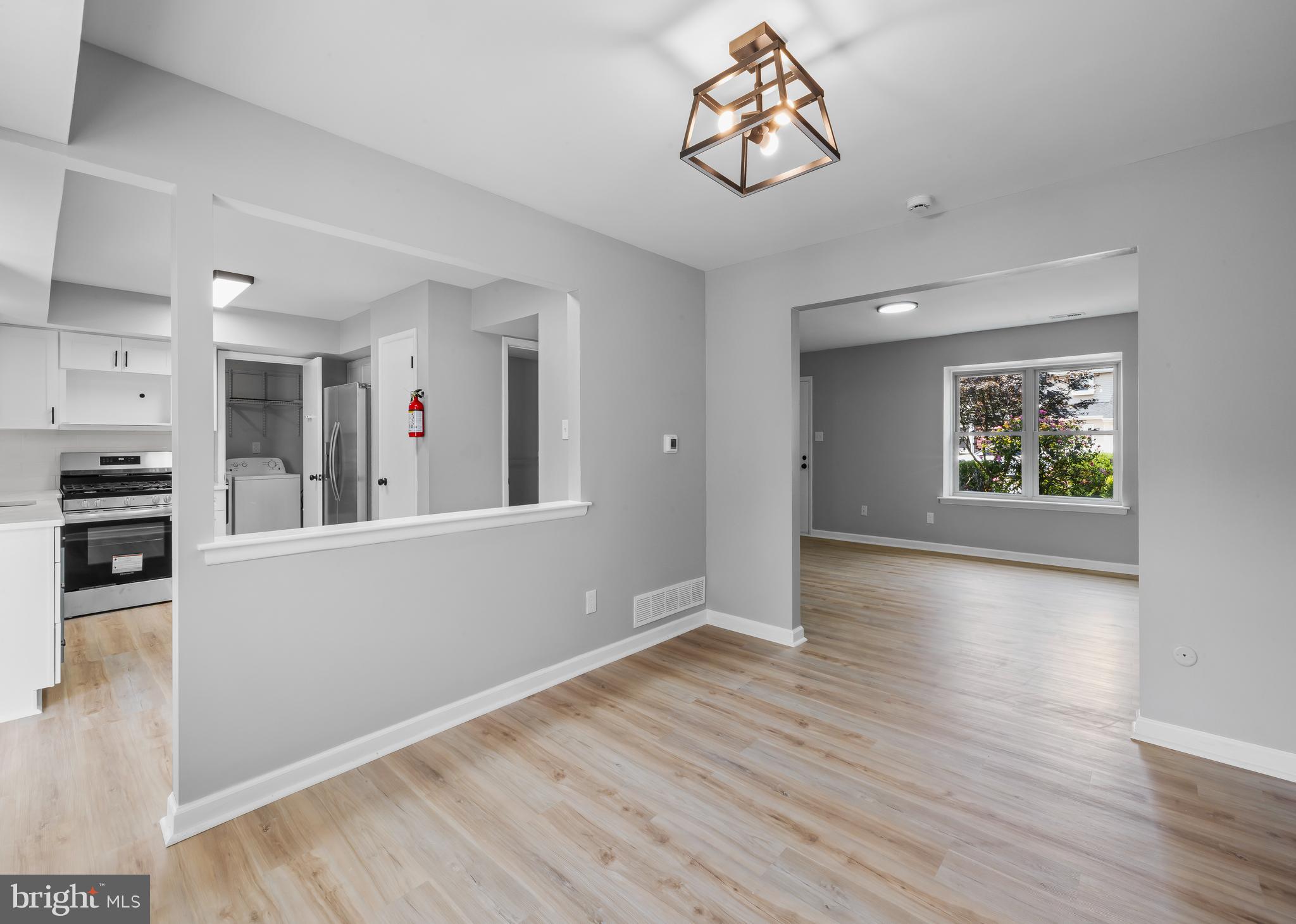 6 Heron Place Clementon, NJ 08021 - Photo 9 of 29 a view of an empty room with window and wooden floor