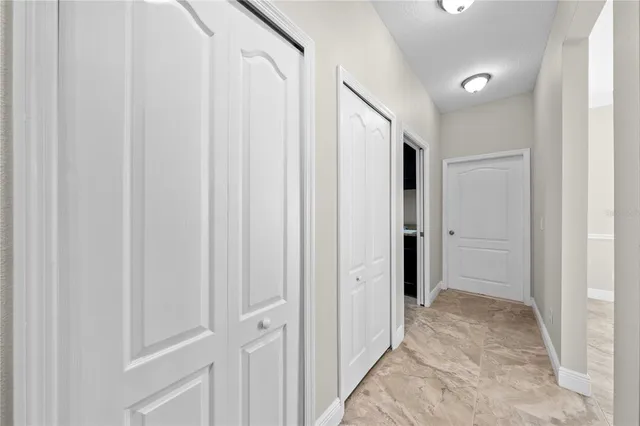 a view of a kitchen with a stove cabinets and a ceiling fan