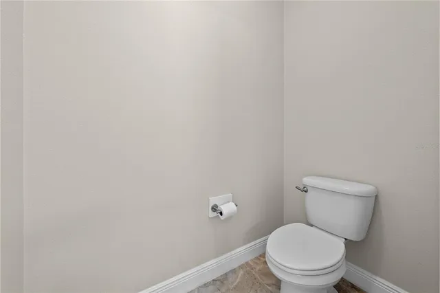 an aerial view of residential houses with outdoor space and street view