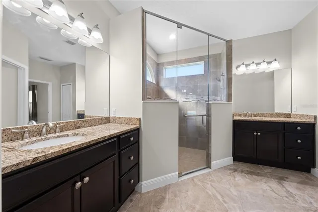 an aerial view of a house with a swimming pool yard and outdoor seating