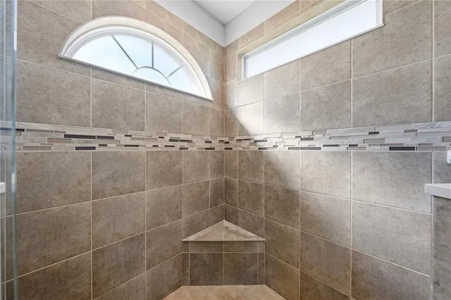 an aerial view of residential houses with outdoor space and swimming pool