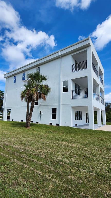7609 Deedra Circle Port Richey, FL 34668 - Photo 16 of 63 a house view with a garden space